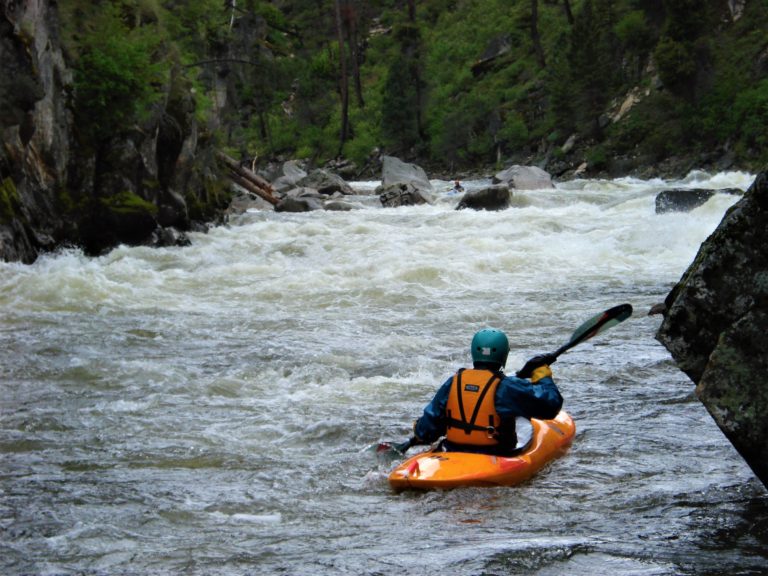 Looking upstream at kayaker running devil creek rapid on the south fork salmon