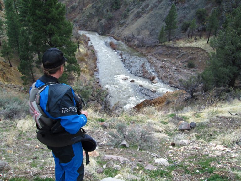 Kayaker scouting the Upper East Fork Carson River from Wolf Creek Road Section