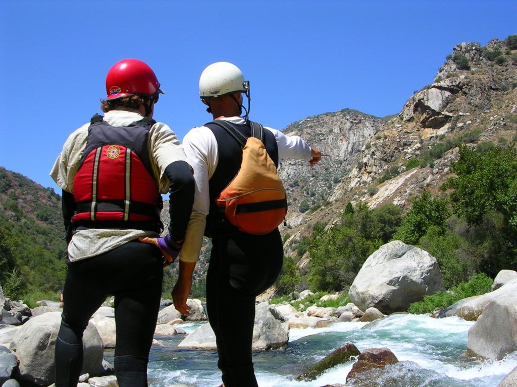 rafters scouting whitewater rapid on an Upper Kings Rivre Garlic Falls Rafting and Kayaking trip