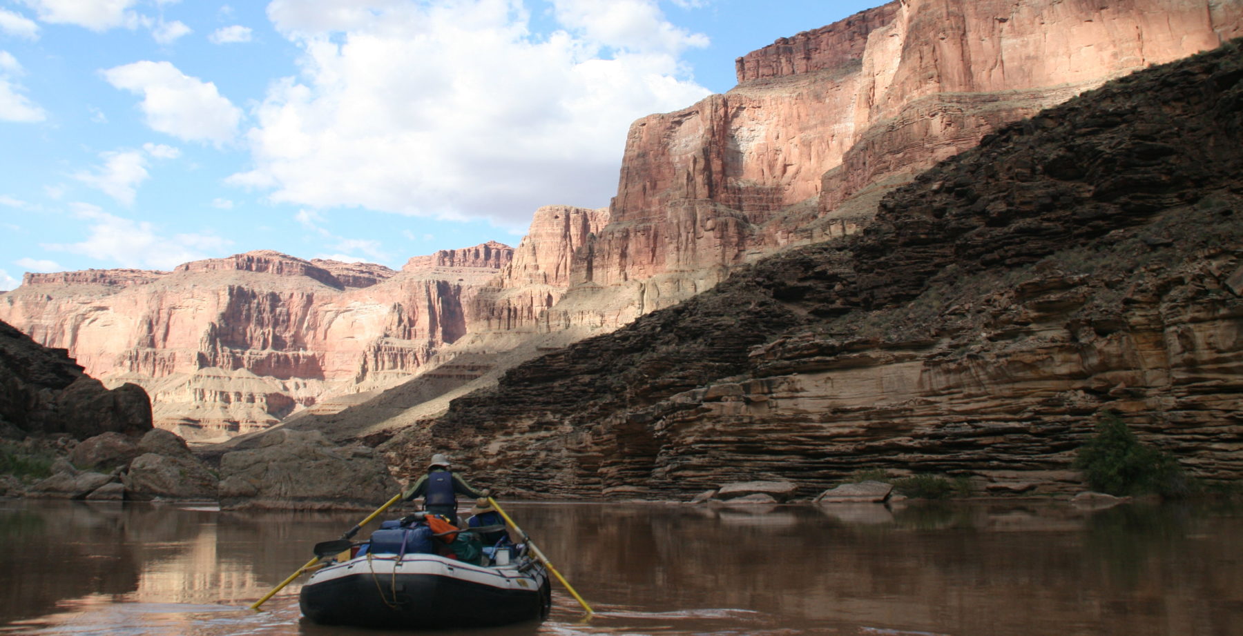 raft floating through Grand Canyon National Park on the Colorado River