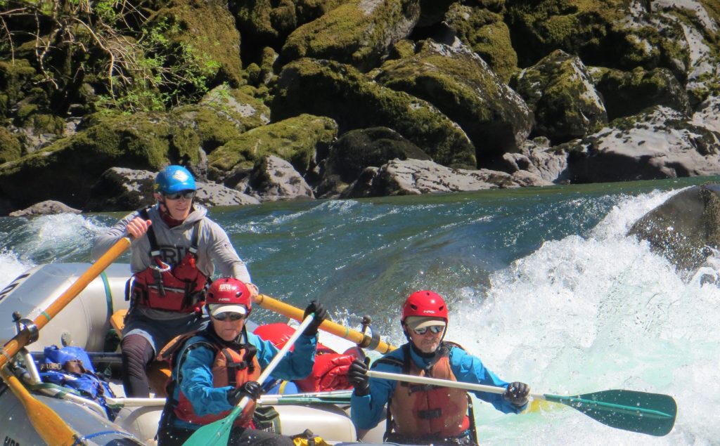 shows what a commercial raft with passengers and  guide looks like