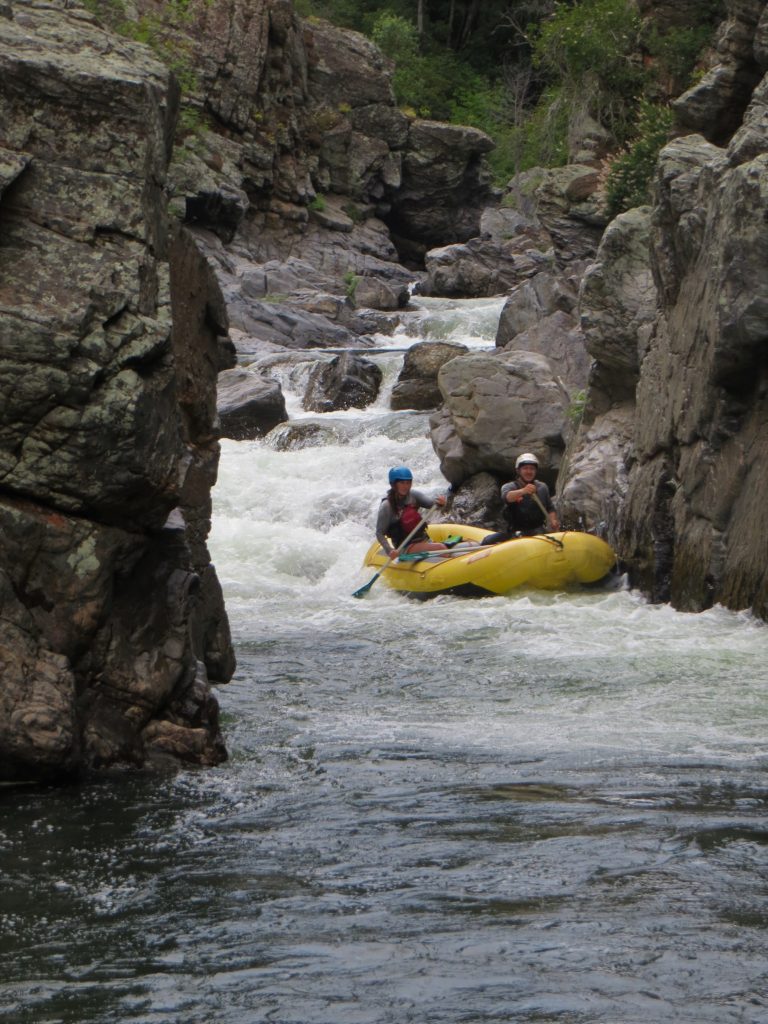 shows raft in vertical walled canyon on the North Fork Tuolumne