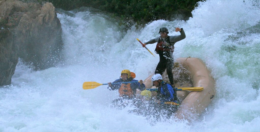 types of rafts where a paddle boat guide being launched