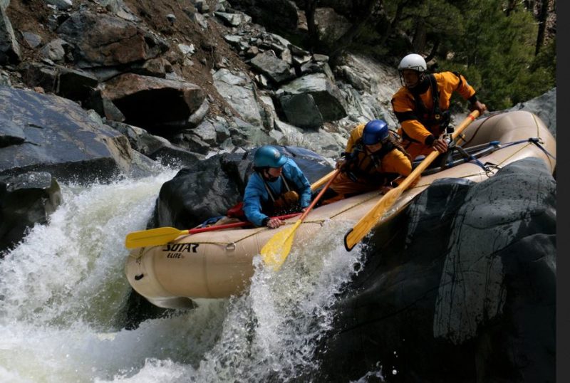 raft with large tubes going over a big drop