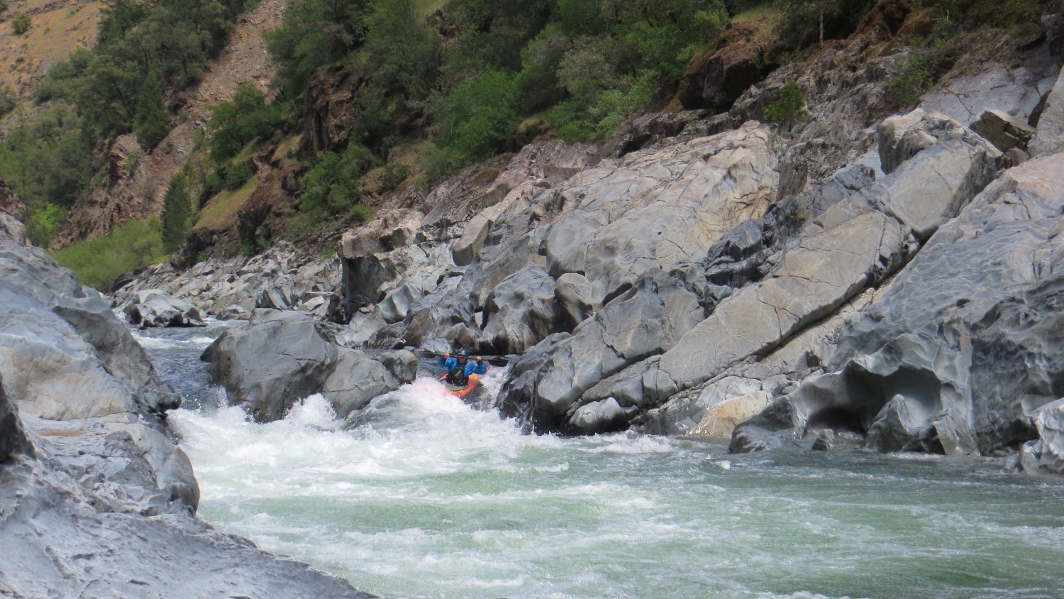 kayaker running Chamberlin Falls North Fork American