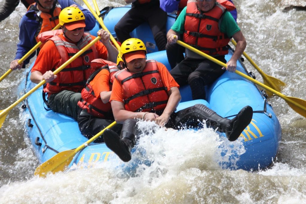 rafters wearing wetsuits and t-shirts