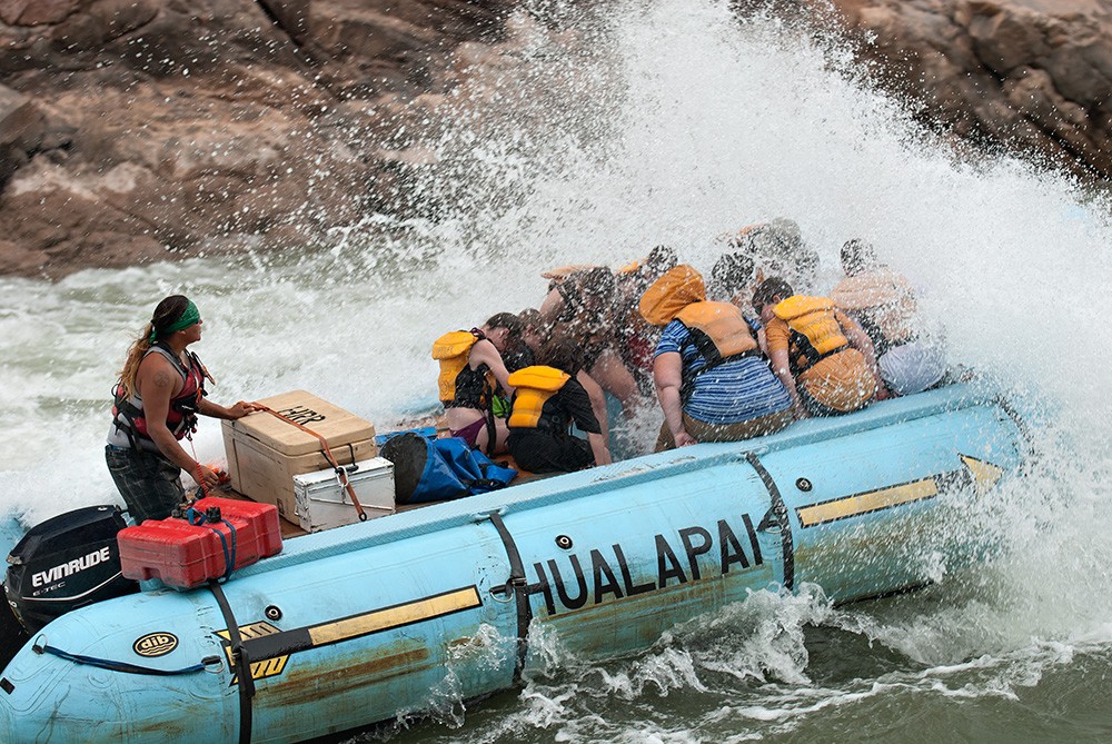 motorized raft running Grand Canyon whitewater rapid