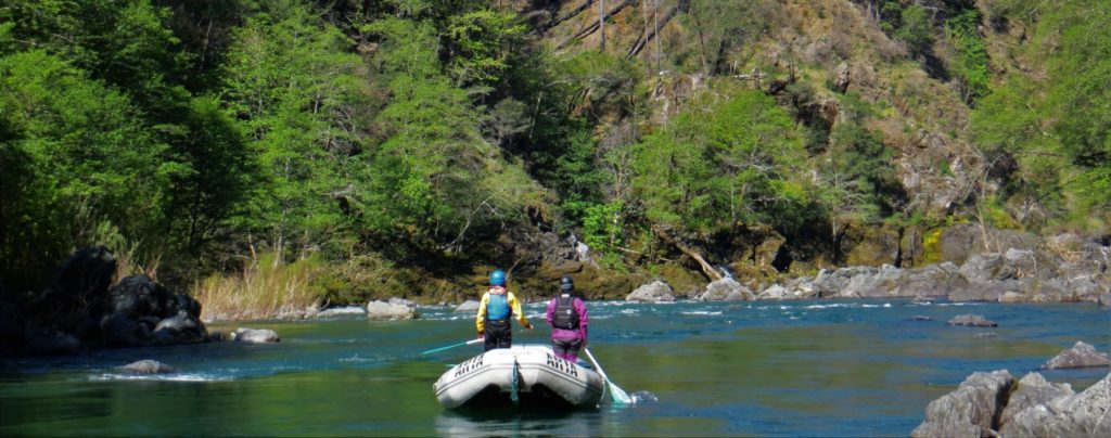 rafters standing up to boat scout a rapid