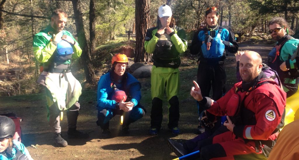 guides meet before launching on rafting trip