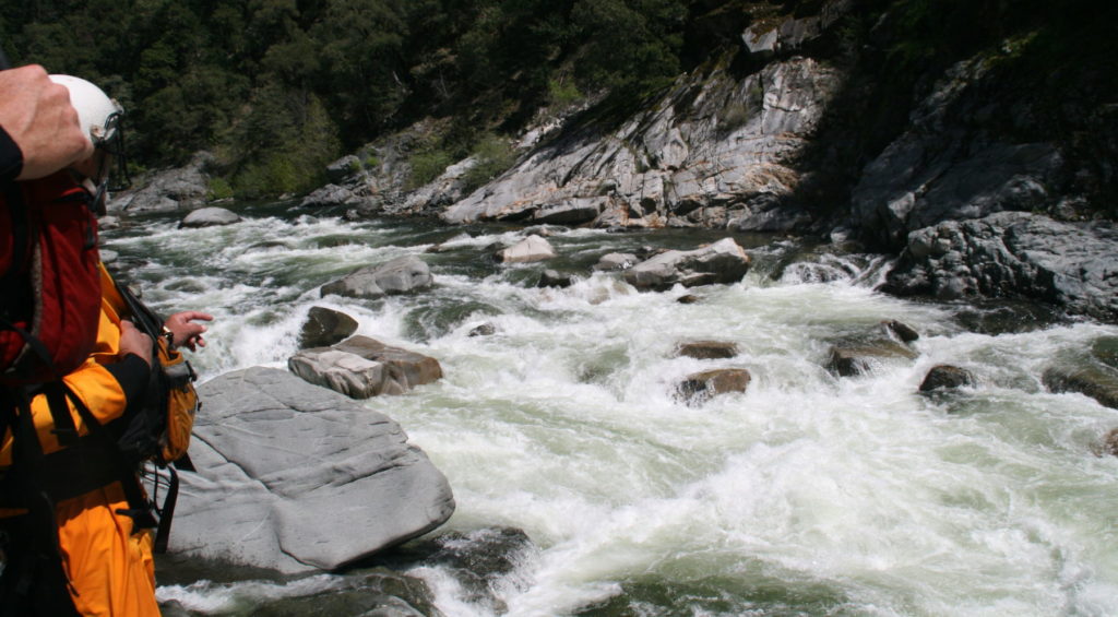 rafters looking upstream scouting rapids