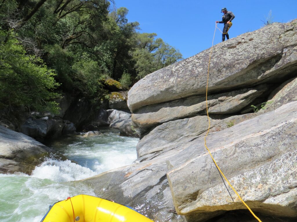 guide using 75 foot throw bag rafting