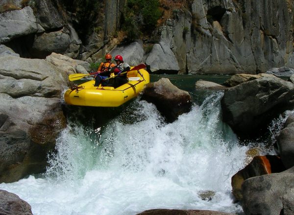 Rafting a falls on the Upper Kings River Garlic Falls rafting and kayaking trip